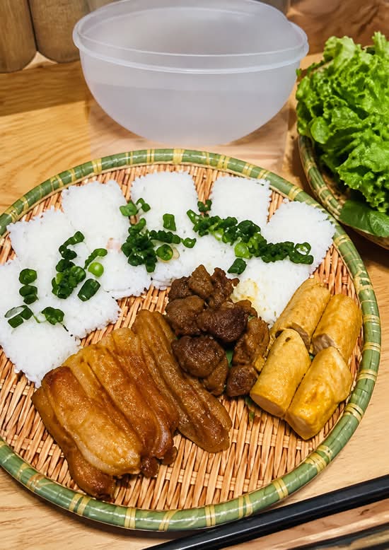 Woven vermicelli with grilled pork, sugarcane prawn, spring rolls and fresh lettuce